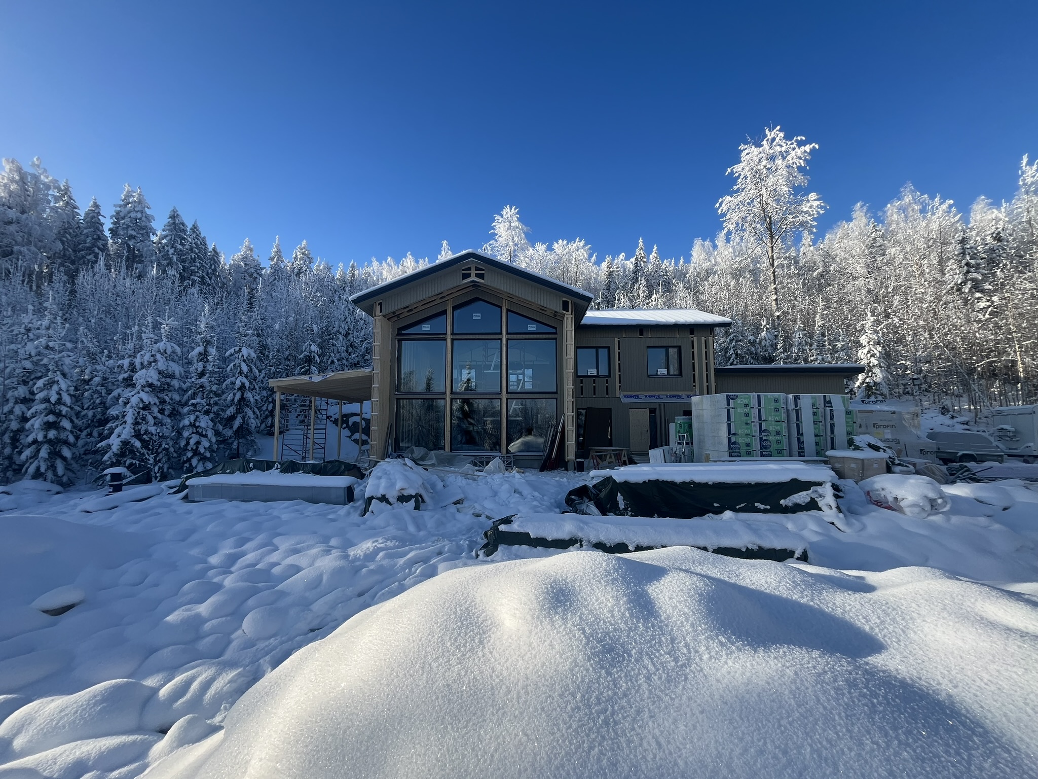 Holiday home under construction in Finnish winter forest